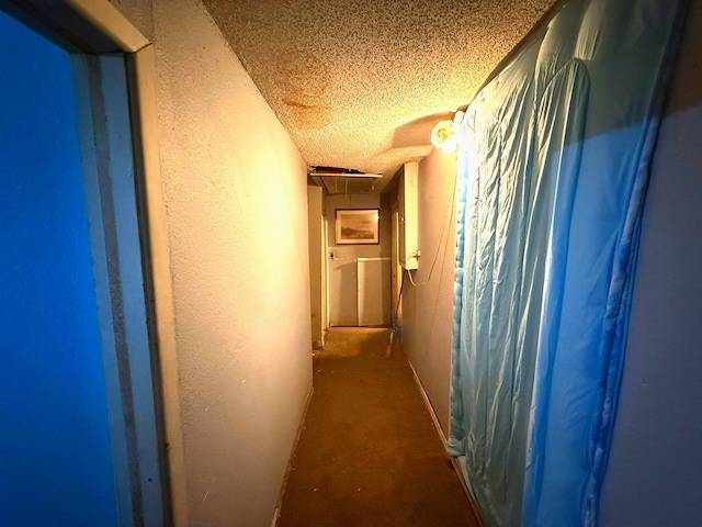 833 N Ave G, Odessa, TX 79763 - corridor with a textured ceiling, a textured wall, unfinished concrete floors, and attic access