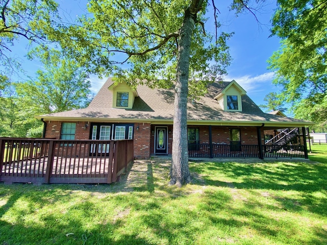 328 Mcguire Rd, Lufkin, TX 75901 - rear view of property with brick siding, a yard, a deck, and a shingled roof