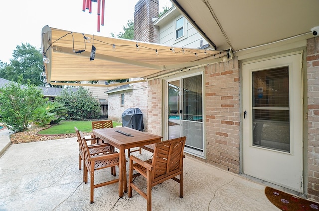 22410 Bucktrout Ln, Katy, TX 77449 - view of patio / terrace with a grill and outdoor dining area