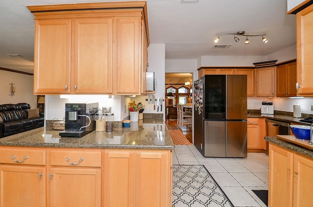 22410 Bucktrout Ln, Katy, TX 77449 - kitchen with stainless steel appliances, light tile patterned flooring, and dark stone countertops