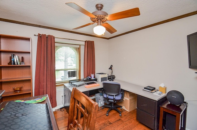 22410 Bucktrout Ln, Katy, TX 77449 - office area with light wood finished floors, a textured ceiling, ceiling fan, and ornamental molding