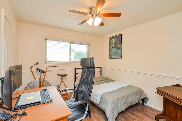 22410 Bucktrout Ln, Katy, TX 77449 - bedroom with wood finished floors, a desk, and ceiling fan