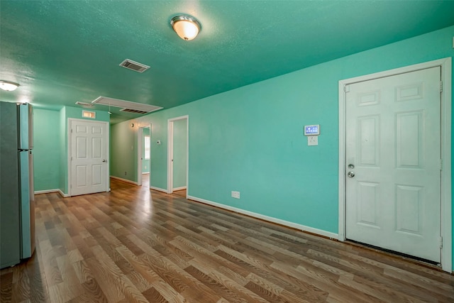 3938 King St, Houston, TX 77026 - spare room with attic access and wood finished floors