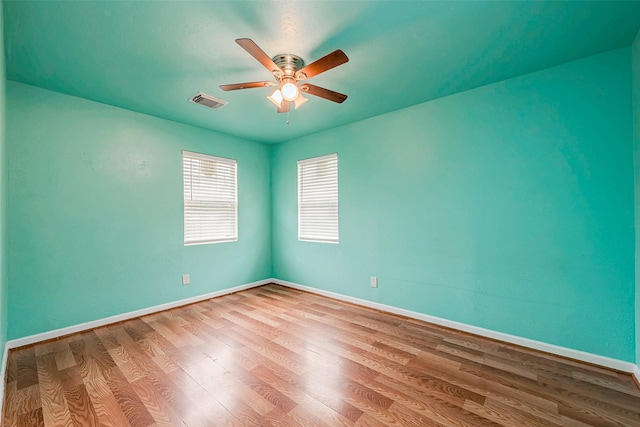 3938 King St, Houston, TX 77026 - spare room with ceiling fan and wood finished floors