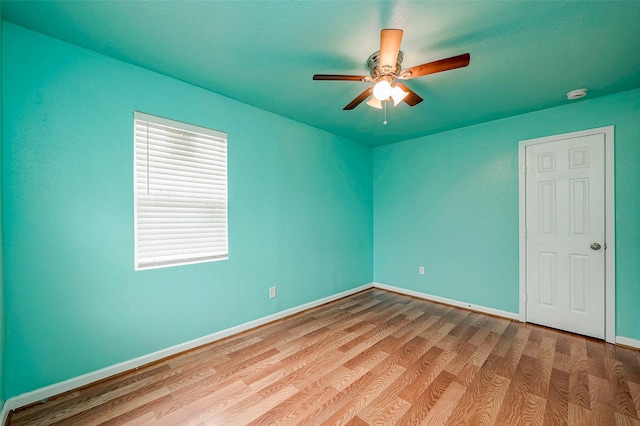 3938 King St, Houston, TX 77026 - empty room featuring wood finished floors, ceiling fan, and a smoke detector