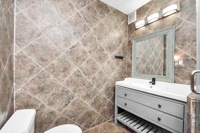 7655 Bellerive Dr Unit 3, Houston, TX 77036 - bathroom with tile walls and vanity