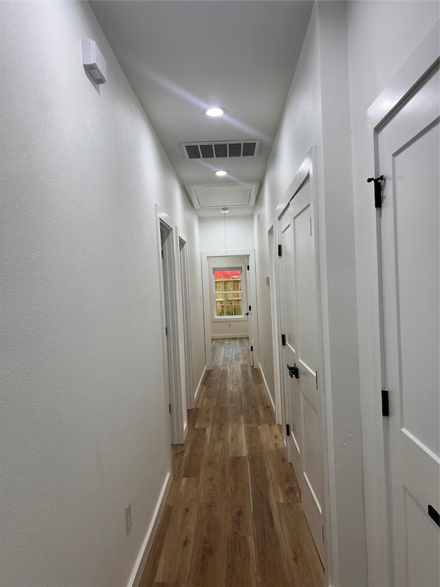 6206 Lyndhurst Dr, Houston, TX 77087 - hallway featuring attic access, wood finished floors, and recessed lighting