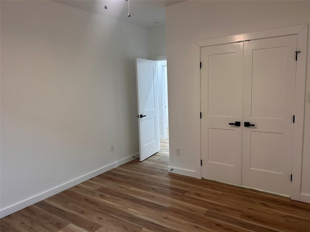 6206 Lyndhurst Dr, Houston, TX 77087 - unfurnished bedroom featuring wood finished floors and a closet