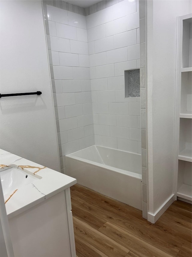 6206 Lyndhurst Dr, Houston, TX 77087 - bathroom with wood finished floors, vanity, and shower / bath combination