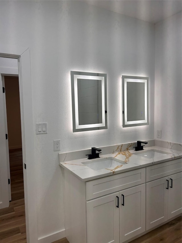 6206 Lyndhurst Dr, Houston, TX 77087 - bathroom featuring double vanity and wood finished floors