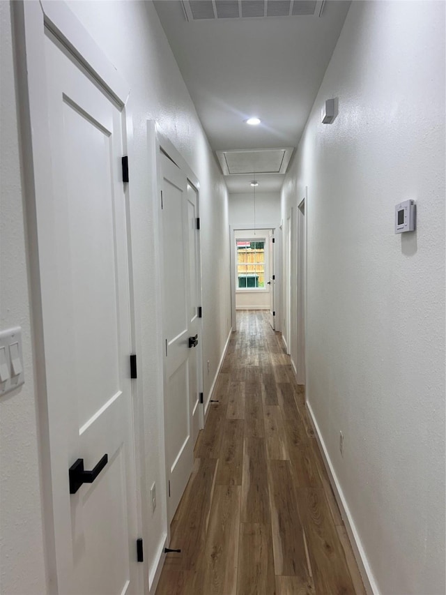 6206 Lyndhurst Dr, Houston, TX 77087 - corridor with attic access and wood finished floors