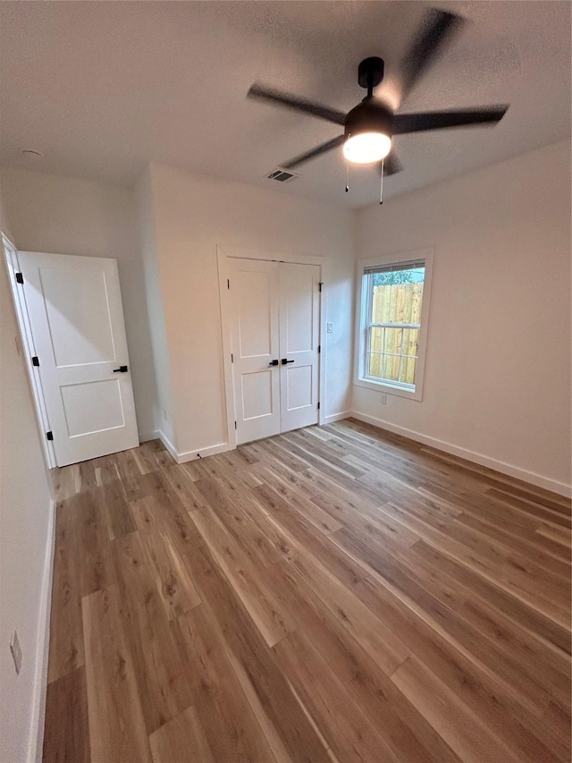 6206 Lyndhurst Dr, Houston, TX 77087 - unfurnished bedroom with wood finished floors, a closet, and ceiling fan