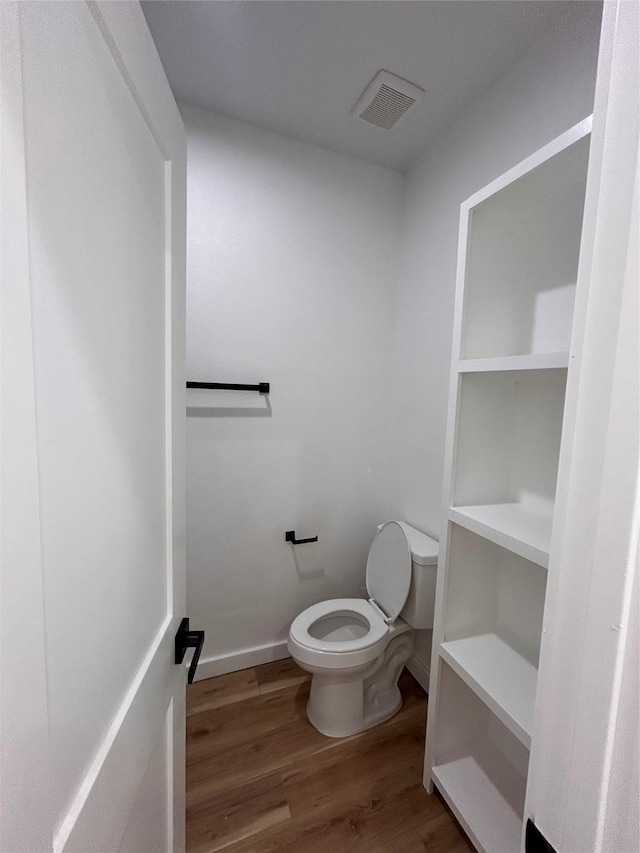 6206 Lyndhurst Dr, Houston, TX 77087 - bathroom with wood finished floors and toilet