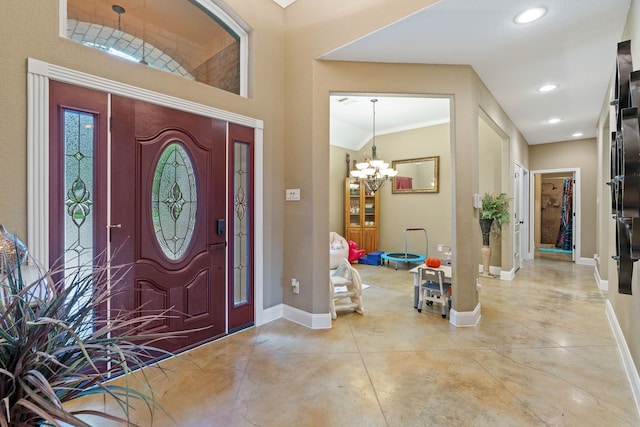 806 Garrett Dr, Magnolia, TX 77354 - entryway featuring finished concrete floors, a chandelier, recessed lighting, and crown molding