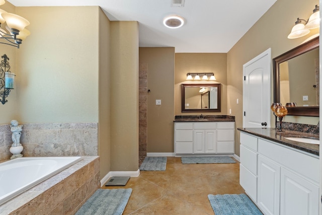 806 Garrett Dr, Magnolia, TX 77354 - bathroom with a tile shower, a garden tub, and two vanities
