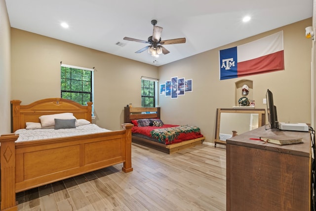 806 Garrett Dr, Magnolia, TX 77354 - bedroom featuring light wood finished floors, recessed lighting, and ceiling fan