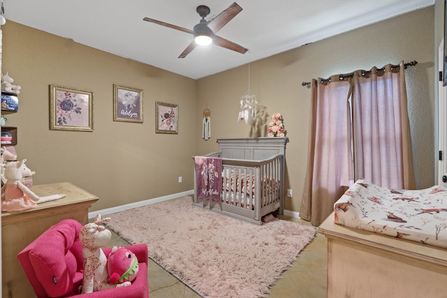 806 Garrett Dr, Magnolia, TX 77354 - bedroom featuring ceiling fan and tile patterned flooring