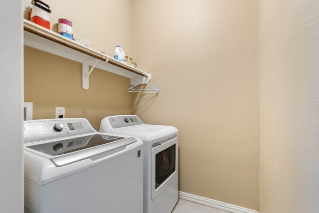 806 Garrett Dr, Magnolia, TX 77354 - washroom with separate washer and dryer and baseboards