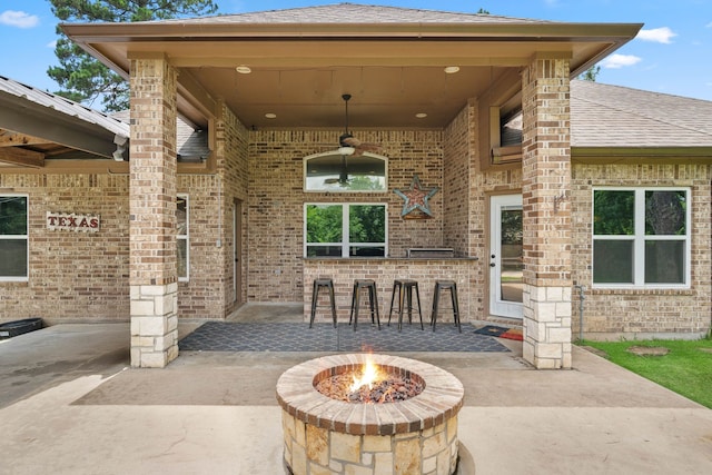 806 Garrett Dr, Magnolia, TX 77354 - view of patio / terrace with exterior bar, an outdoor fire pit, and ceiling fan