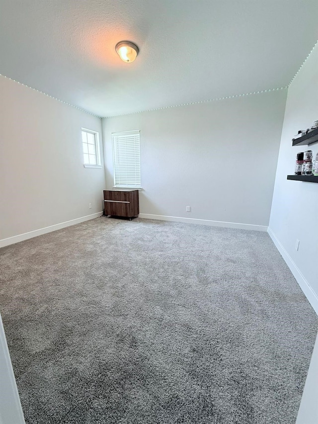 18542 Twilight Arbor Trl, Richmond, TX 77407 - carpeted spare room featuring baseboards
