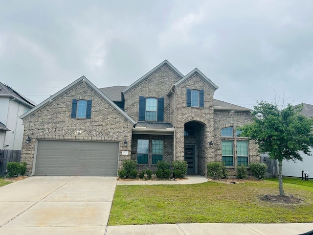 18542 Twilight Arbor Trl, Richmond, TX 77407 - french country style house featuring driveway, brick siding, an attached garage, and a shingled roof