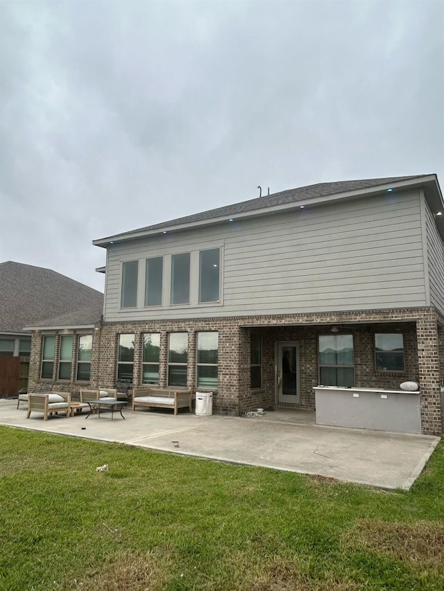 18542 Twilight Arbor Trl, Richmond, TX 77407 - back of property with a patio, brick siding, and a yard