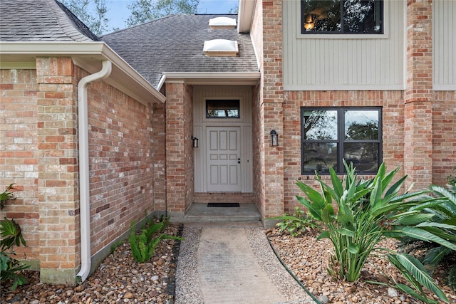 4611 Diamond Springs Dr, Missouri City, TX 77459 - view of exterior entry featuring a shingled roof and brick siding
