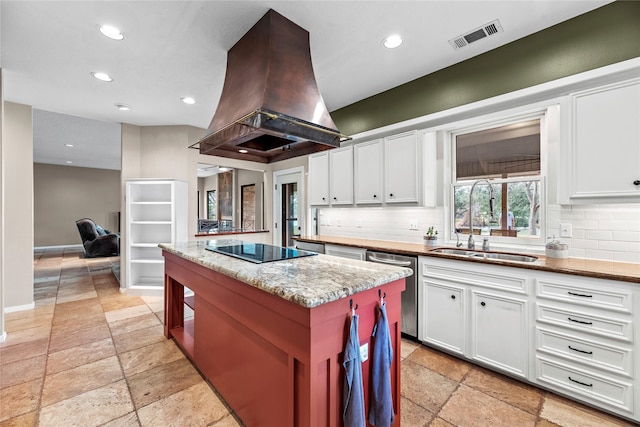 4611 Diamond Springs Dr, Missouri City, TX 77459 - kitchen featuring stainless steel dishwasher, stone tile flooring, black electric stovetop, island range hood, and decorative backsplash