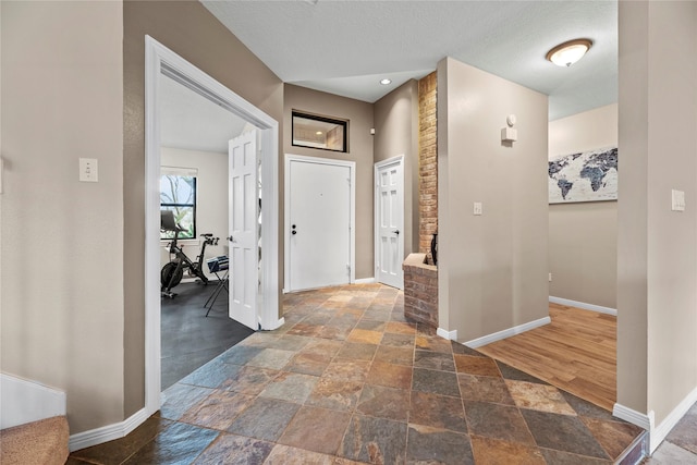 4611 Diamond Springs Dr, Missouri City, TX 77459 - entrance foyer featuring stone tile floors and a textured ceiling