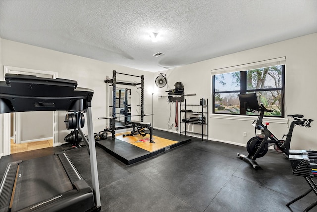 4611 Diamond Springs Dr, Missouri City, TX 77459 - workout area with a textured ceiling and baseboards