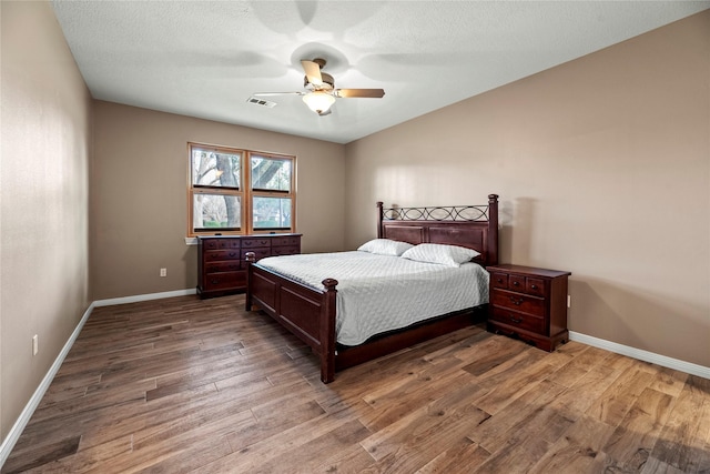 4611 Diamond Springs Dr, Missouri City, TX 77459 - bedroom with wood finished floors and a ceiling fan