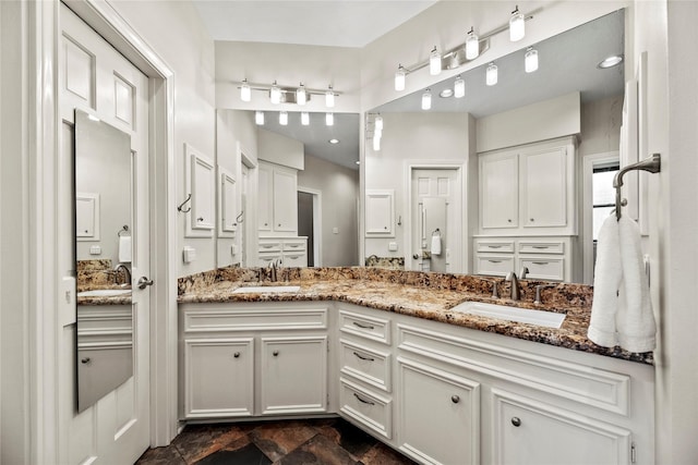 4611 Diamond Springs Dr, Missouri City, TX 77459 - bathroom featuring double vanity and stone finish floors