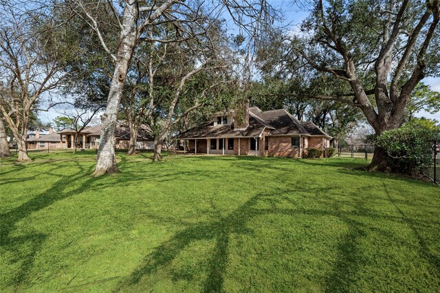 4611 Diamond Springs Dr, Missouri City, TX 77459 - view of yard featuring covered porch