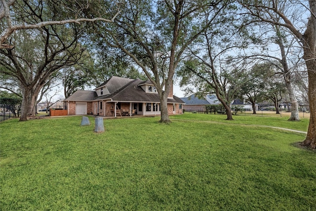 4611 Diamond Springs Dr, Missouri City, TX 77459 - view of yard with covered porch and a garage