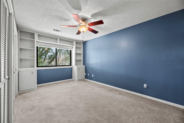 4611 Diamond Springs Dr, Missouri City, TX 77459 - unfurnished room with a ceiling fan, carpet floors, and a textured ceiling
