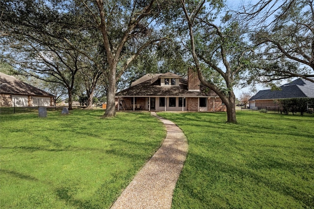 4611 Diamond Springs Dr, Missouri City, TX 77459 - rear view of property featuring a chimney, a lawn, brick siding, and a porch