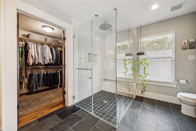 1014 E 25th St, Houston, TX 77009 - full bathroom featuring a stall shower and a walk in closet