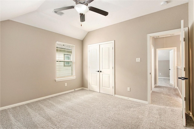 20226 Overland Hills Ln, Cypress, TX 77433 - unfurnished bedroom with attic access, vaulted ceiling, carpet, a closet, and a ceiling fan