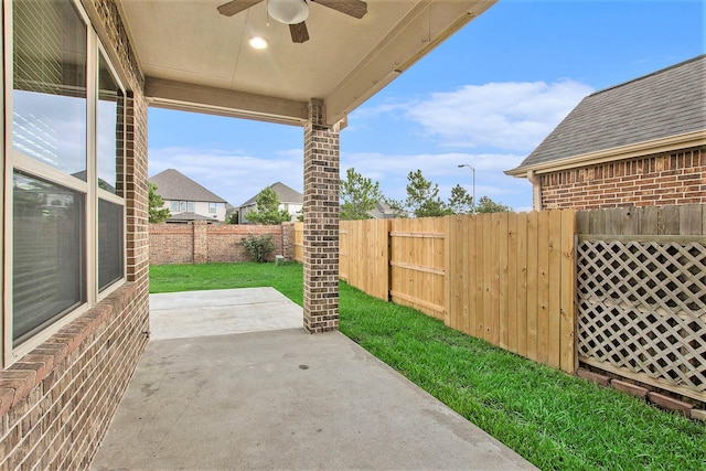 20226 Overland Hills Ln, Cypress, TX 77433 - fenced backyard with a ceiling fan and a patio