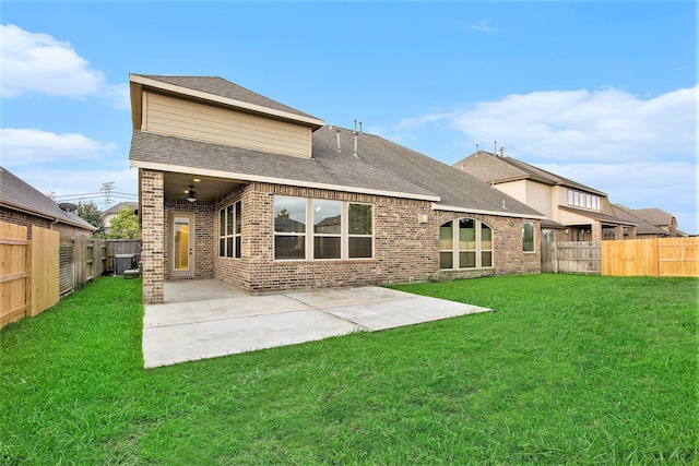 20226 Overland Hills Ln, Cypress, TX 77433 - back of house featuring brick siding, a fenced backyard, a patio area, and roof with shingles