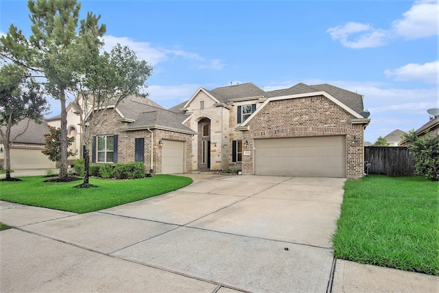 20226 Overland Hills Ln, Cypress, TX 77433 - french country home featuring brick siding, an attached garage, and roof with shingles