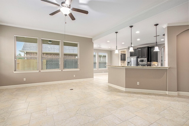 20226 Overland Hills Ln, Cypress, TX 77433 - kitchen with stainless steel appliances, crown molding, ceiling fan, open floor plan, and light countertops