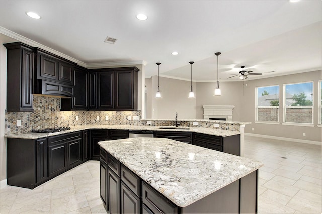 20226 Overland Hills Ln, Cypress, TX 77433 - kitchen featuring ceiling fan, a peninsula, decorative backsplash, light stone countertops, and ornamental molding