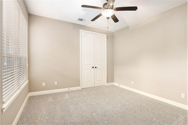20226 Overland Hills Ln, Cypress, TX 77433 - unfurnished bedroom with carpet floors, a closet, and a ceiling fan
