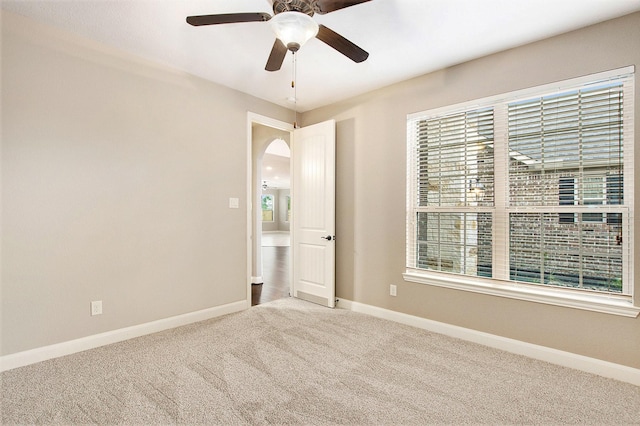 20226 Overland Hills Ln, Cypress, TX 77433 - carpeted spare room with plenty of natural light, a ceiling fan, and arched walkways