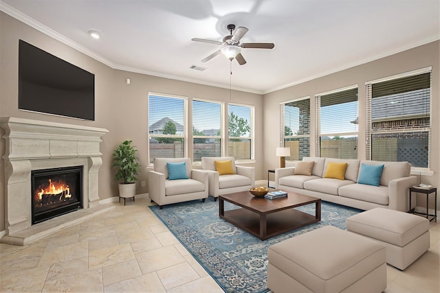 20226 Overland Hills Ln, Cypress, TX 77433 - living room with ceiling fan, ornamental molding, a high end fireplace, and stone tile floors
