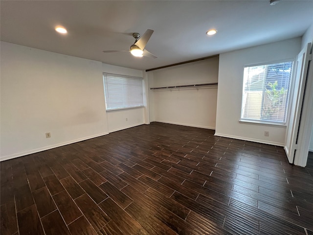 2372 Woodland Park Dr Unit 121, Houston, TX 77077 - unfurnished bedroom with dark wood-style floors, ceiling fan, recessed lighting, and a closet