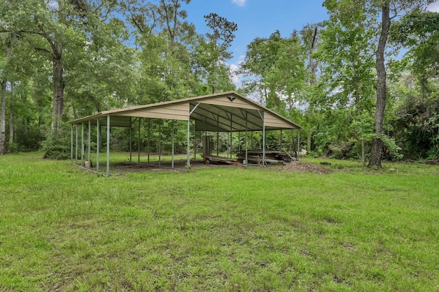 17230 Pioneer Trl, Conroe, TX 77302 - view of grassy yard featuring a carport
