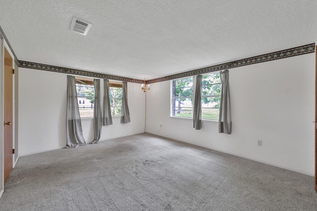 17230 Pioneer Trl, Conroe, TX 77302 - carpeted spare room with a textured ceiling