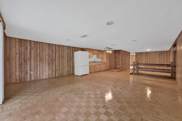 17230 Pioneer Trl, Conroe, TX 77302 - unfurnished living room with wooden walls